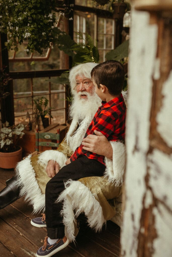 The Singing Santa of Atlanta talking to a child about his Christmas wishes. 