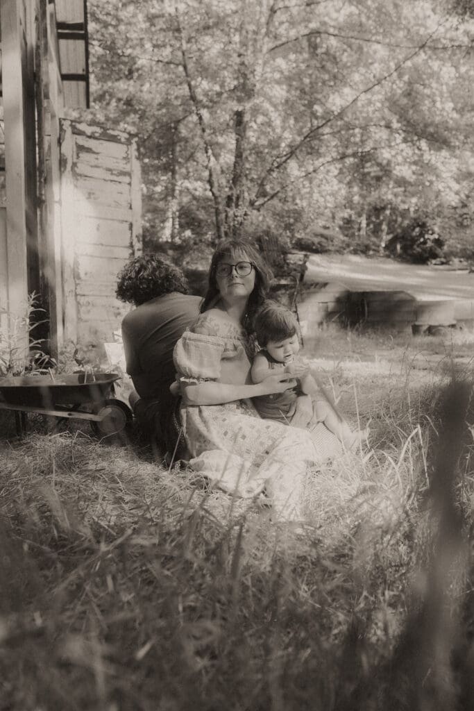 Calm, unposed family photography moment in soft spring light at Das Hinterhaus greenhouse