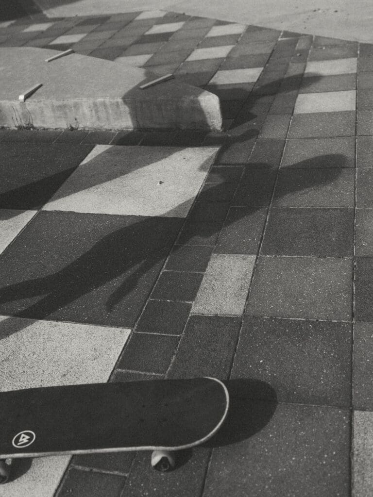 black and white image of mom and daughter's shadow while skateboarding