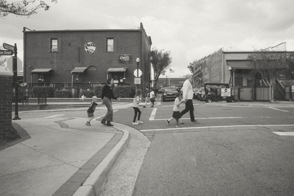 whole family walks across the crosswalk in acworth, ga